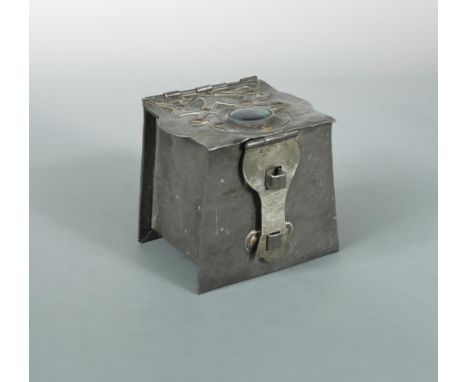 An Arts &amp; Crafts pewter box or tea caddy with enamel cabochon, the repoussé box with applied strap work hinge, the cover 