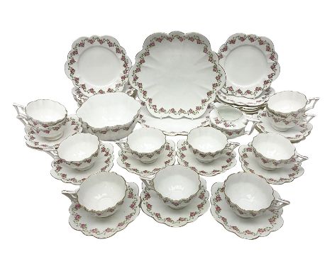 Shelley Late Foley part tea service, pattern number 10137, decorated with roses, comprising eleven teacups and twelve saucers