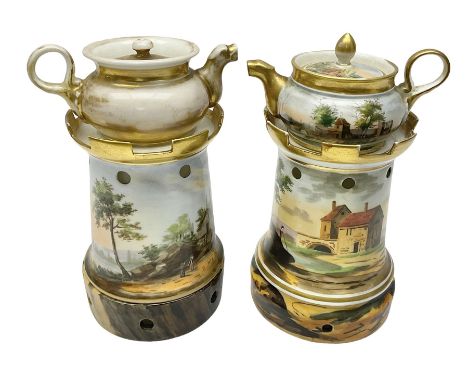  Two 19th century continental teapots and warmers, each teapot upon a cylindrical warming base, hand printed with landscapes,