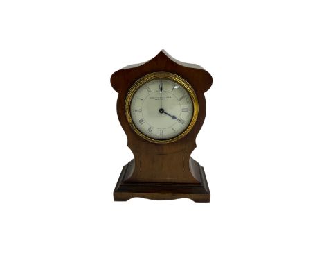 Edwardian -  bedside table clock in a mahogany veneered case in the Art Nouveau style,  with a fixed bezel and enamel dial, R