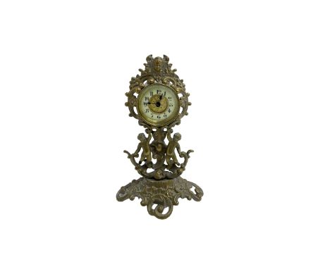 British united clock company - early 20th century English timepiece mantle clock, with a decorative brass case depicting putt