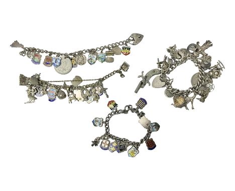 Four charm bracelets, with charms including animals and enamel country and towns, scarecrow, gun and some silver examples