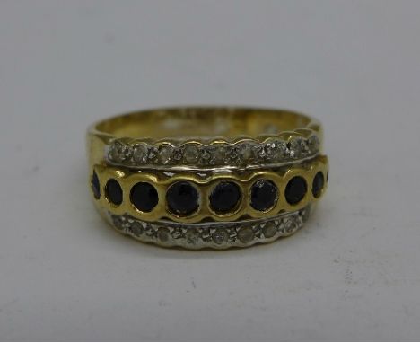 A 14ct gold black and white stone ring, 4.1g, P, marked 585