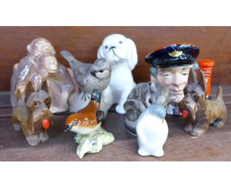 A mixed collection of china figures, including a Beswick wren, Beswick dog, a pair of carved wooden Scottie dogs, a Sylvac gi