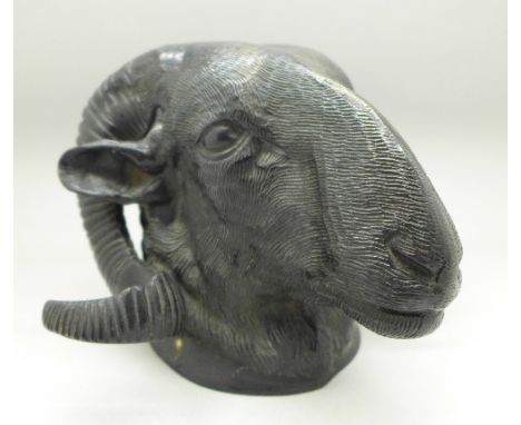 A hollow cast bronze figure of a ram's head, no foundry or maker's mark, 15cm