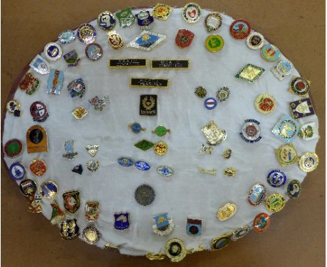 A collection of enamel badges including bowling and Royal Enfield Gun Club