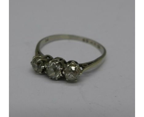 A platinum and three stone diamond ring, marked PT, 1.8g, K