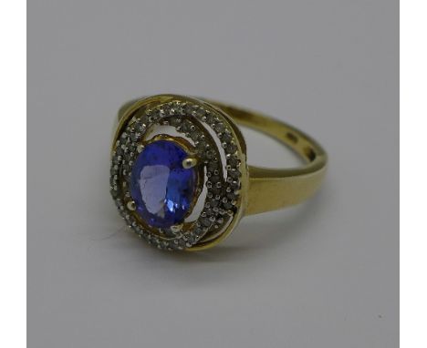 A silver gilt, tanzanite and diamond ring, P