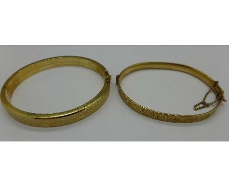 Two bangles, one marked 9ct gold bronze core