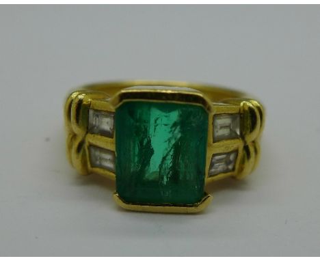 An 18ct gold, emerald and diamond ring, 7.5g, M, emerald 9mm x 7mm