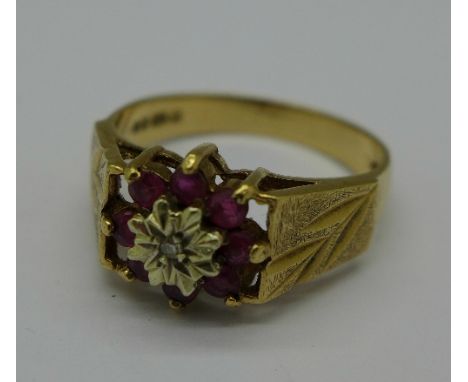 A 1970's 9ct gold, diamond and ruby ring, 3.2g, O