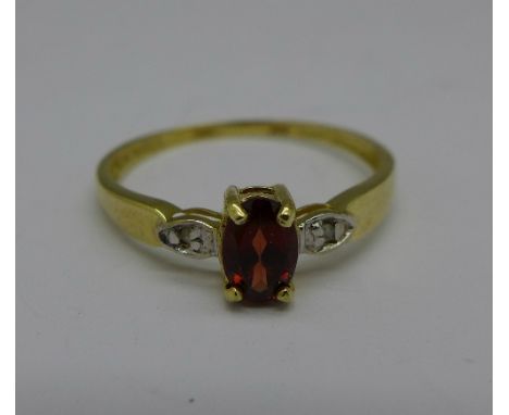 A 9ct gold, garnet and diamond ring, 1g, O