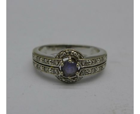 A 9ct white gold, diamond and purple stone ring, 2.9g, N