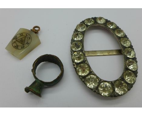 A Georgian white metal paste set buckle, a fob and a ring