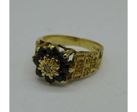 A 9ct gold, sapphire and diamond ring, 3.6g, M