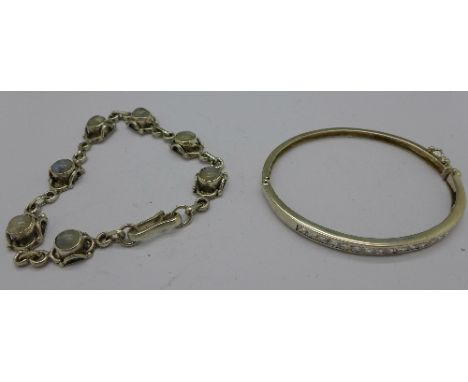 A silver stone set bracelet and bangle