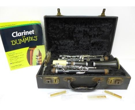 A Buisson clarinet with case and book