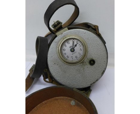 A ECS Detect French pigeon racing clock in a leather case