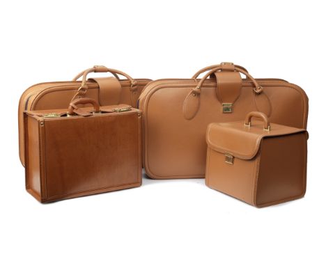 Three pieces of tan leather Ferrari 456GT luggage by Schedoni, Italian,comprising two soft-sided suitcases, each 76cm wide, a