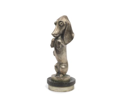 A 'Teckel' mascot by A. Becquerel for Etling, French, circa 1920,signed, nickel plated bronze sausage dog, 16cm tall, mounted