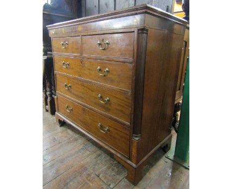 A Georgian mahogany and oak lined chest of three long and two short drawers with marquetry inlaid frieze raised on bracket su