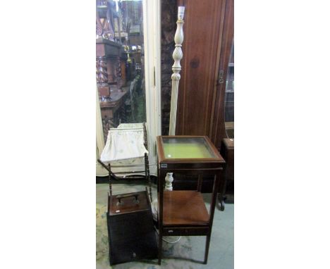 A two tier mahogany bijouterie type table of square cut form, the shallow glazed hinged top raised on four slender square cut