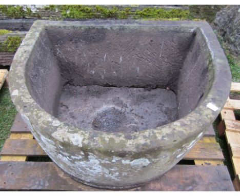 A natural stone D end shaped trough, 92cm long x 77cm wide x 45cm high approx