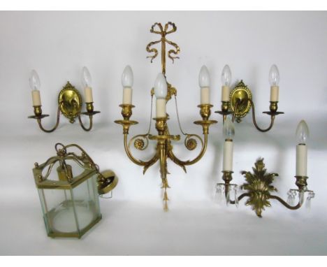A collection of classical style lighting to include a French empire style three branch wall sconce, hall lights, prismatic dr