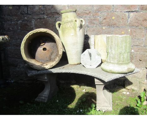 A cast composition stone garden bench, a reproduction weathered sun dial of octagonal form with pierced gnomon dated 1714, st