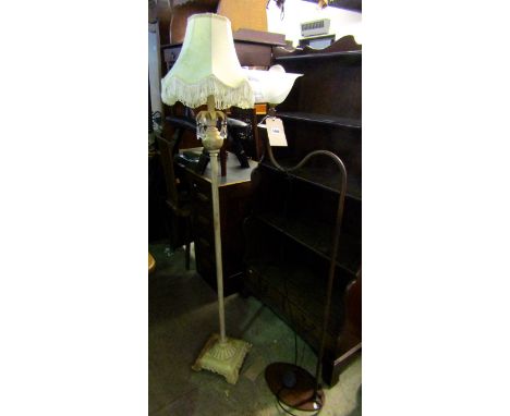 A small contemporary cream painted wooden standard lamp with fluted stem, fan shaped collar raised on a square stepped and fl