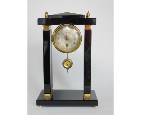 Attractive polished black slate and brass portico mantle clock, the single train 7 cm silvered dial painted with Arabic numer