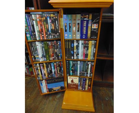 A cabinet containing a large quantity of DVDs including some box sets - The West Wing, Lord of the Rings, The Wire, etc