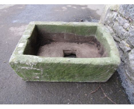 A small natural stone trough of rectangular form with single D end, 60 cm long x 42 cm wide x 20 cm in height approx