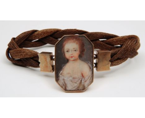 An early 19th century portrait miniature - half length study of a child in lace trimmed gown, set in a gilt metal mount, 3.5c