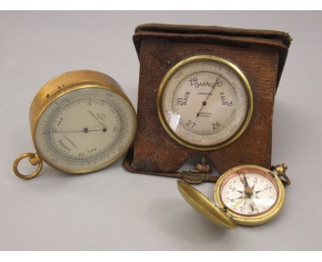 Negretti & Zambra compensated barometer with silvered dial and brass case, number 2627, 15cm diameter, a travelling compensat
