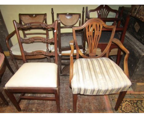 A Georgian Hepplewhite shield back elbow chair with upholstered seat, a further pair of Hepplewhite dining chairs on square t