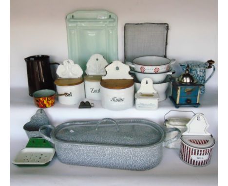 A large collection of antique French and other enamel to include a fish pan with lid, various tea and sugar pots, colanders, 