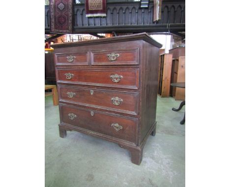 A Georgian oak bedroom chest of three long and two short graduated drawers with moulded outline raised on bracket supports, 9