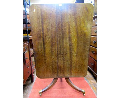 A Georgian mahogany breakfast table the rectangular top raised on a simple column support and swept tripod base, 105cm max