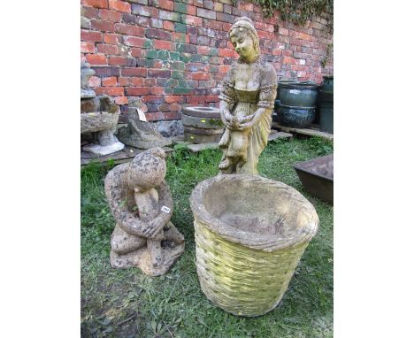 A weathered cast composition stone garden figure of a maiden clutching a bird, together with one other figure in seated pose 