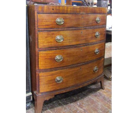 A regency mahogany bow fronted chest of four long graduated drawers, with caddy top raised on swept supports, 95cm wide