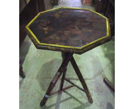 A late Victorian bamboo occasional table of octagonal form with decorative lacquered panel top, raised on crossed tripod supp