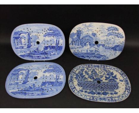 A pair of 19th century Spode drainers of oval form with blue and white printed decoration of figures before a temple and rive