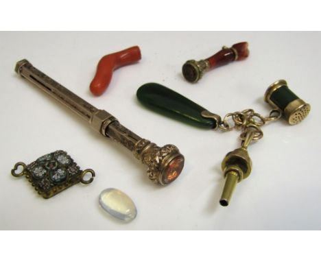 Yellow metal items comprising a watch key with two attached jade charms, an engraved propelling pencil with foiled paste set 