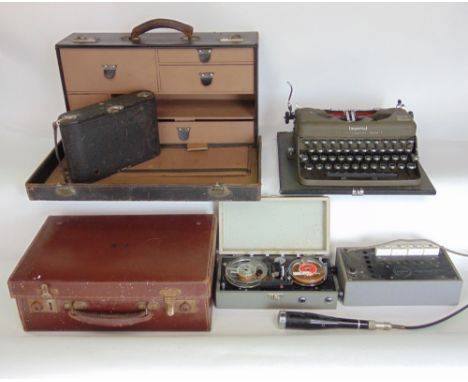 A mixed lot to include a vintage leather cased typewriter, a further leather travelling case fitted with various drawers, ano