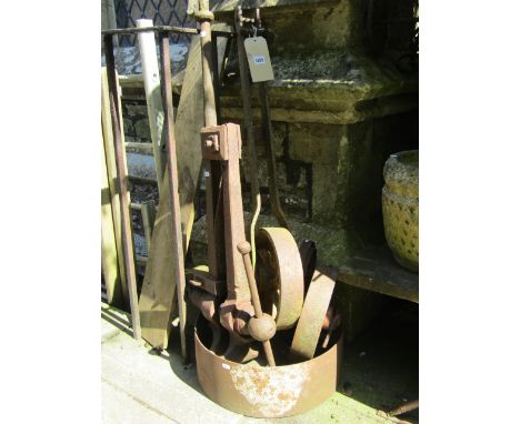 Four vintage cast iron agricultural wheels, a cast iron hand operated water pump, old leg vice, boot scrapers and a "Mowlight