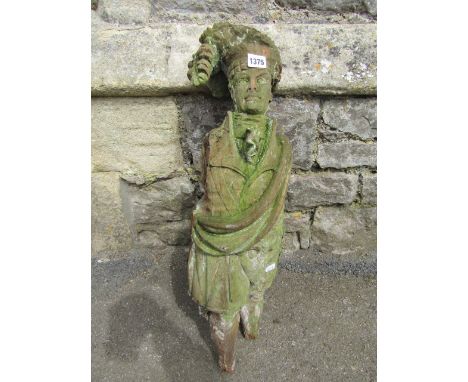 A weathered, well detailed carved wooden figure of a highlander, wearing a kilt with sporran, jacket, sash and headdress, wit