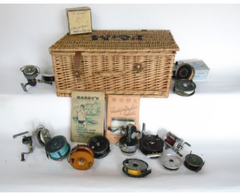 A Fortnum & Mason hamper filled with a collection of various Hardy and other fishing reels