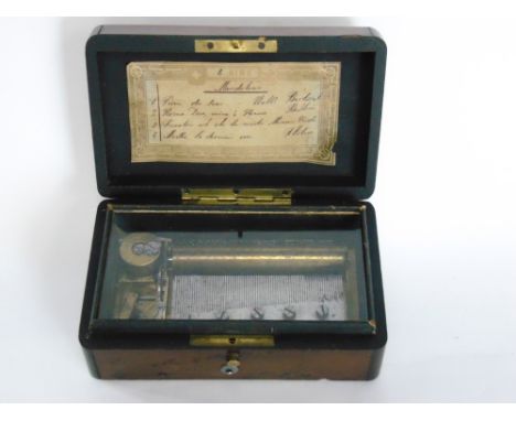 A 19th century yew wood cased music box playing on four aires, 15cm wide