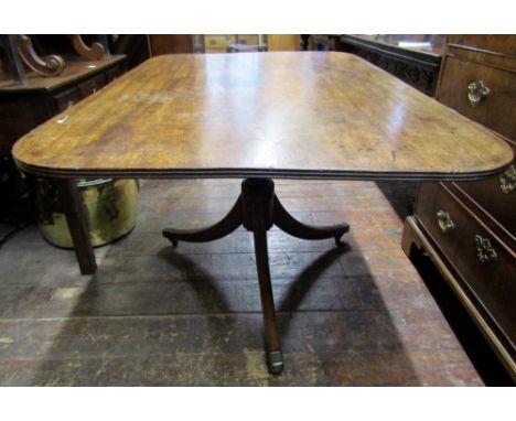 A 19th century mahogany snap top breakfast table of rectangular form, with reeded outline and rounded corners raised on a sha